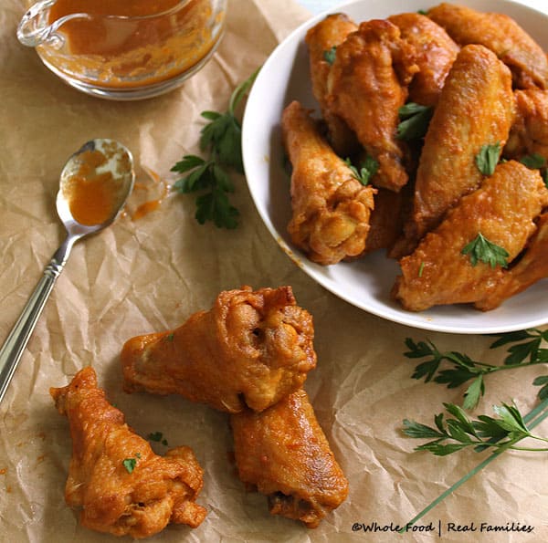 Roasted Pepper Hot Wings from homemade hot sauce. Crispy, oven-baked wings perfect for family movie night or tailgating. Get more whole food , healthy recipes at www.wholefoodrealfamilies.com