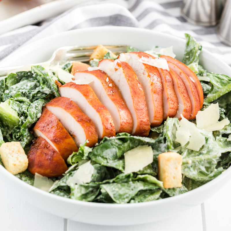 Serve smoked chicken breast over salad