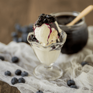 Homemade blueberry compote over ice cream