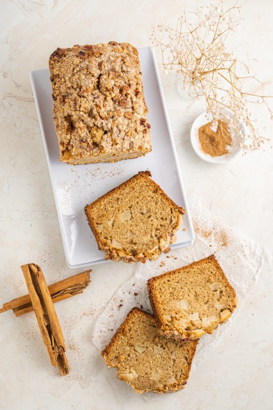 Apple bread with cinnamon and sugar topping cut into pieces.