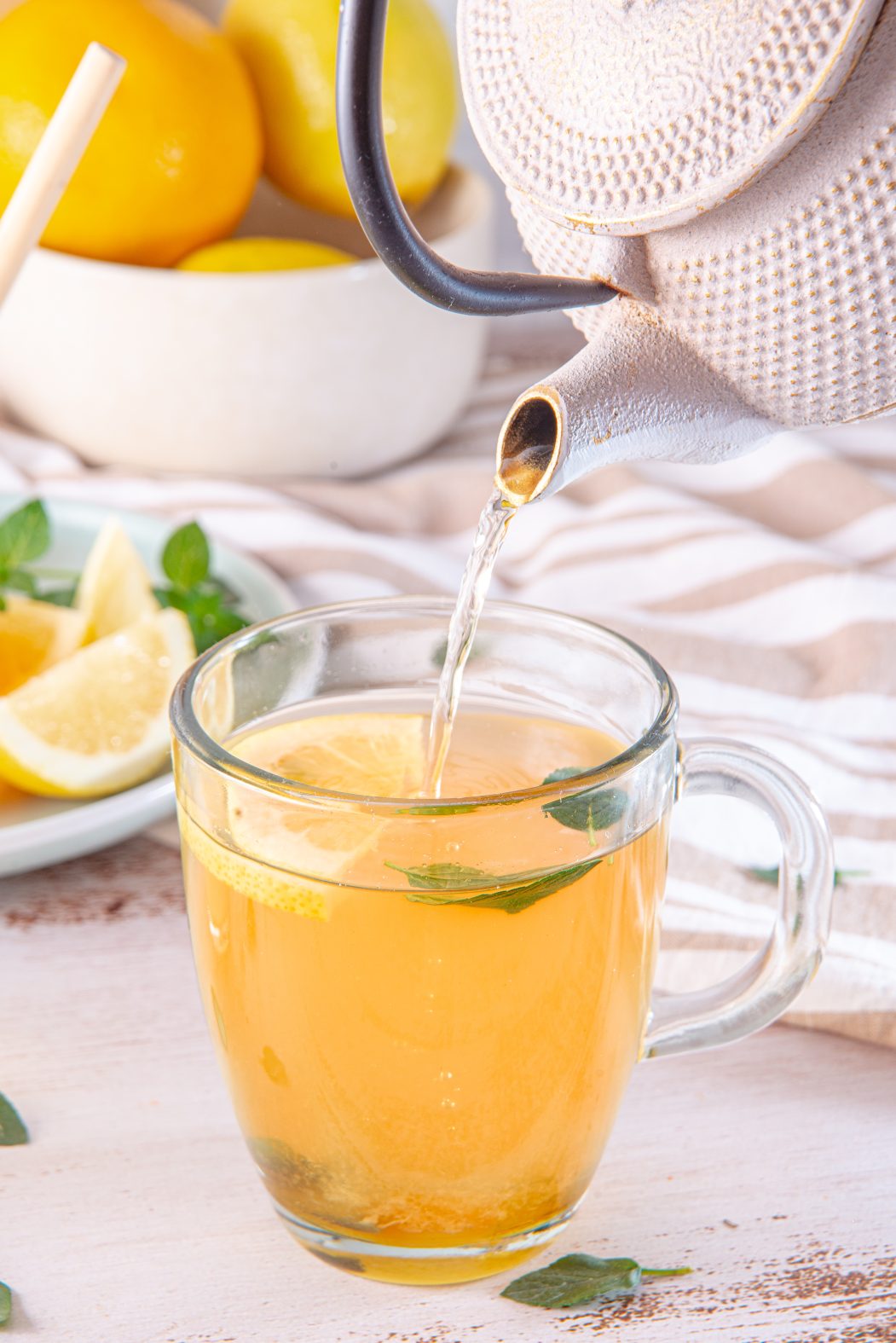 Honey Citrus Mint Tea poured from a teapot
