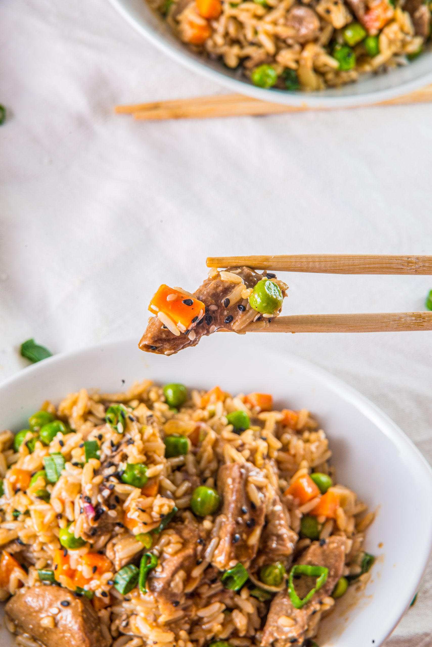 Steak-fried-rice-in-a-bowl-with-chopsticks