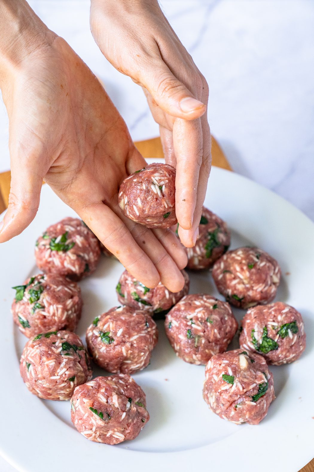 Making Albondigas meatballs