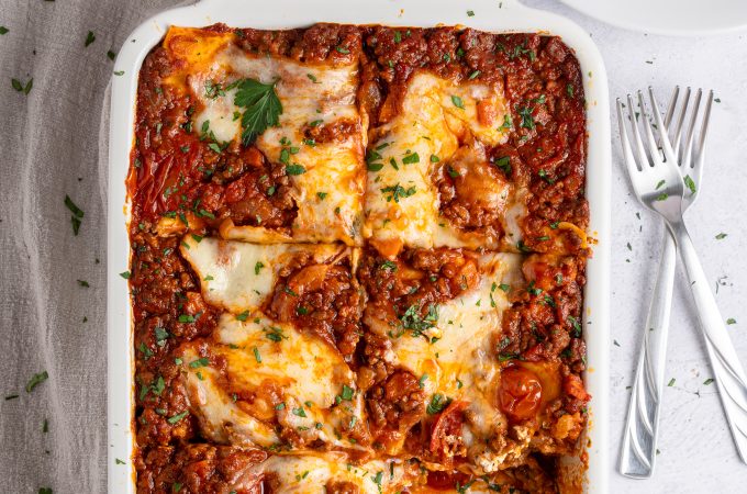 Overhead of lasagna casserole with a missing serving