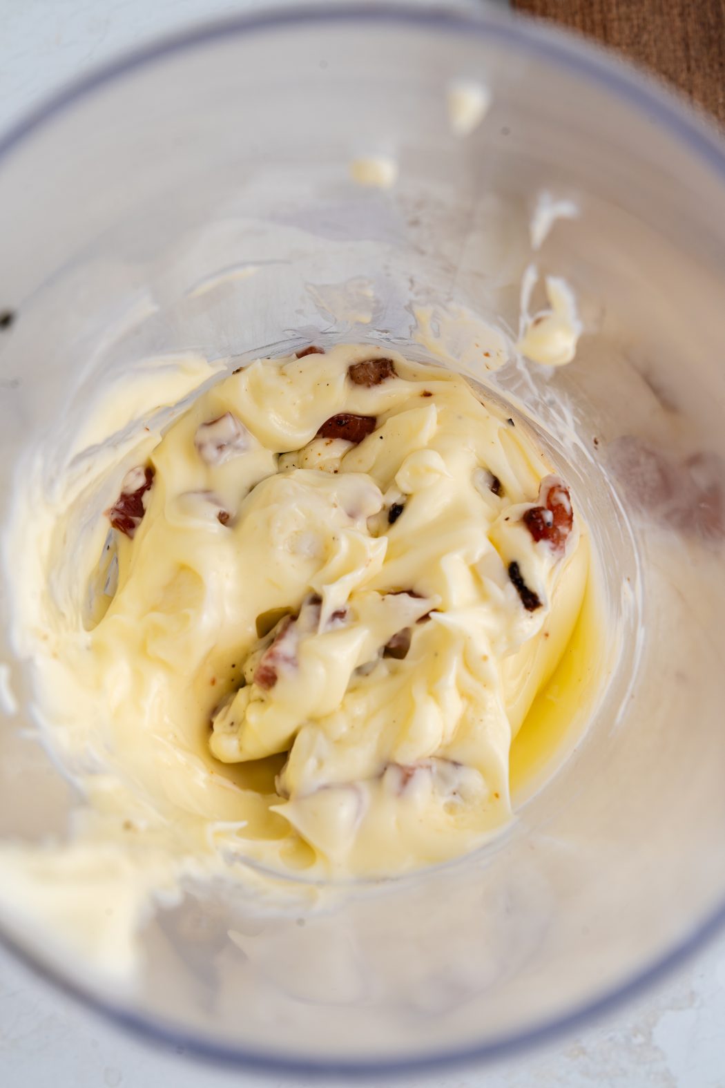 Mixing bacon aioli ingredients