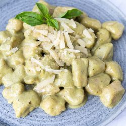 Overhead of potato gnocchi served on a blue plate