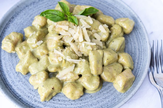 Overhead of potato gnocchi served on a blue plate