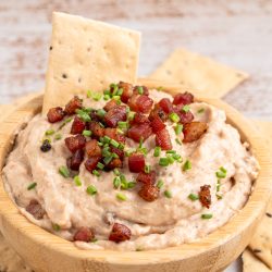 A bowl of bacon aioli with crackers