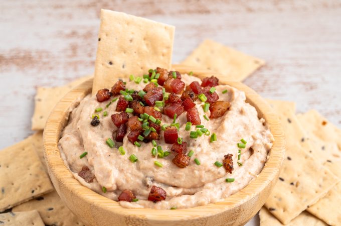 A bowl of bacon aioli with crackers