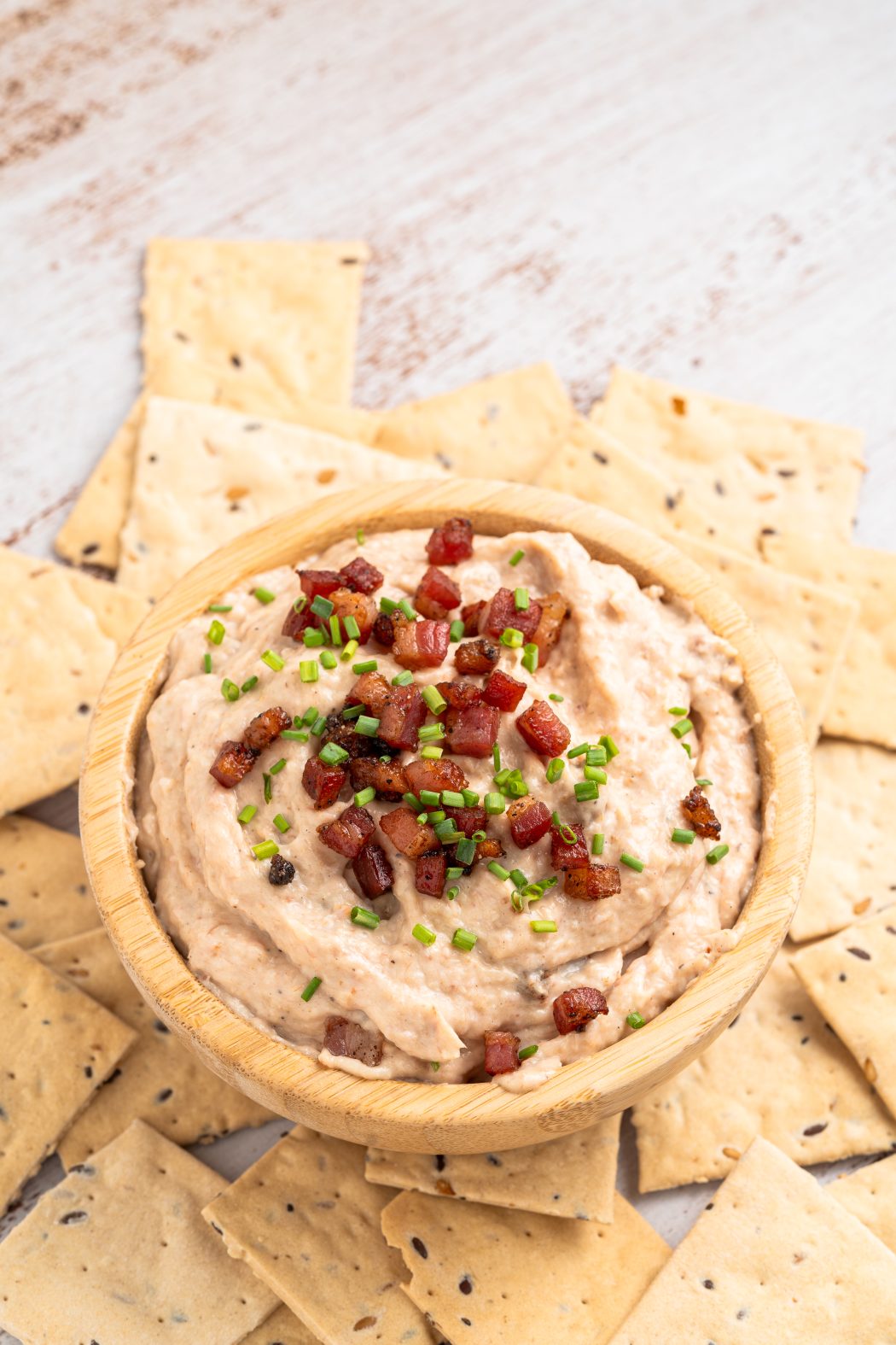 Overhead of crackers and bacon aioli