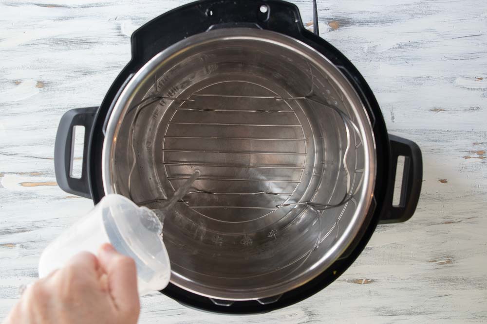 water being poured into an instant pot