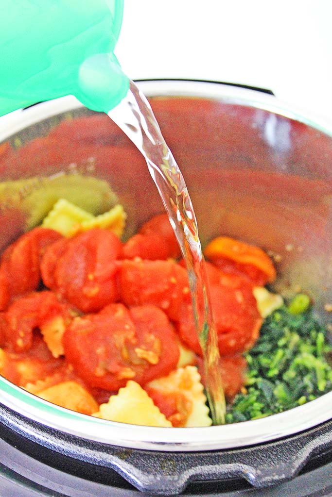 crushed tomatoes and broth in an Instant Pot