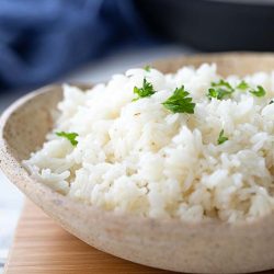 long grain white rice on a plate in front of an Instant Pot