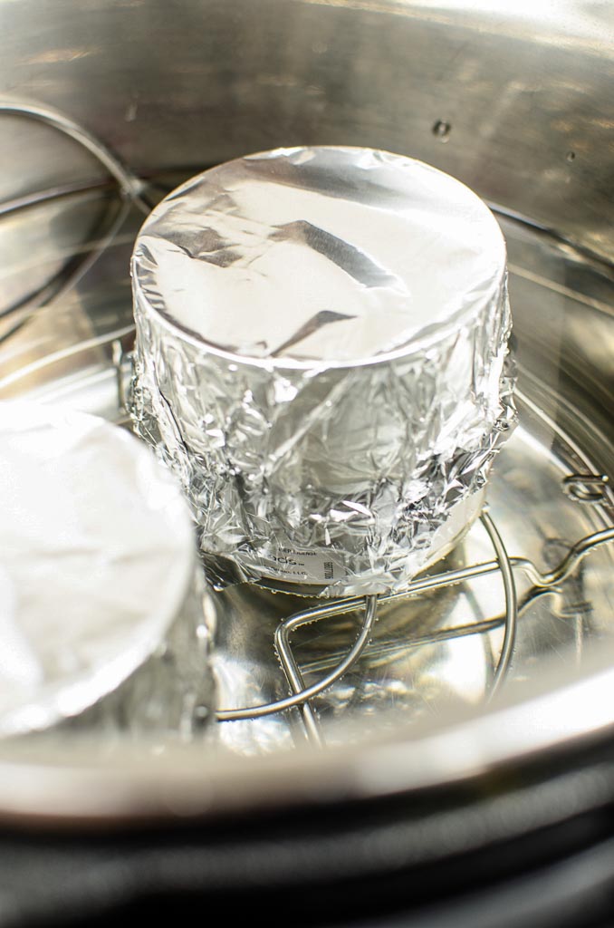 sweetened condensed milk covered with tin foil inside an Instant pot 