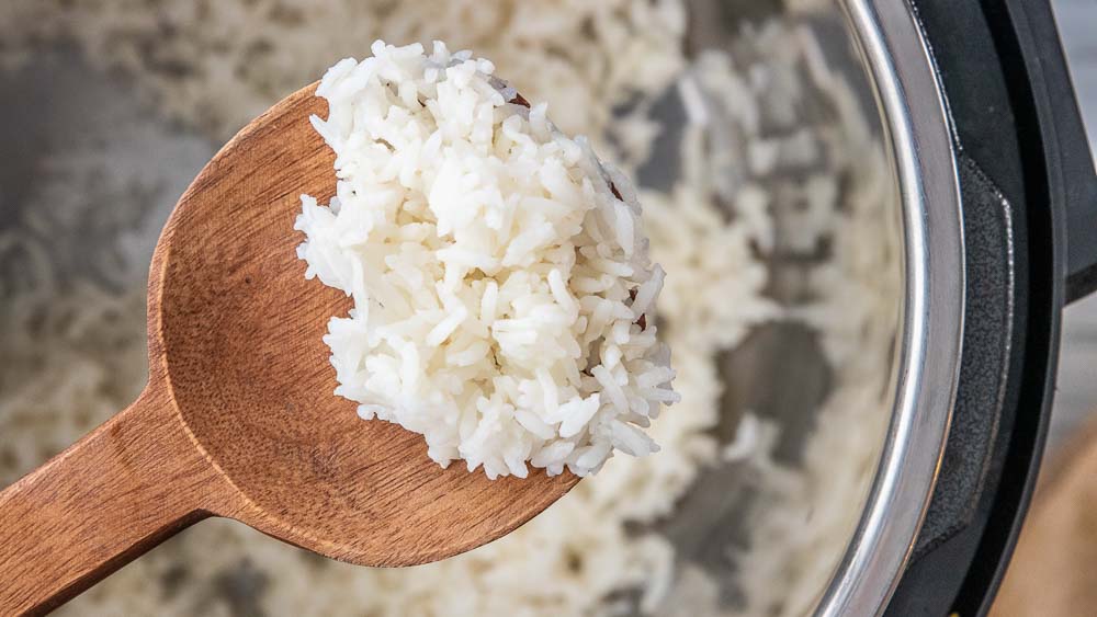long grain white rice on a spoon in an Instant Pot