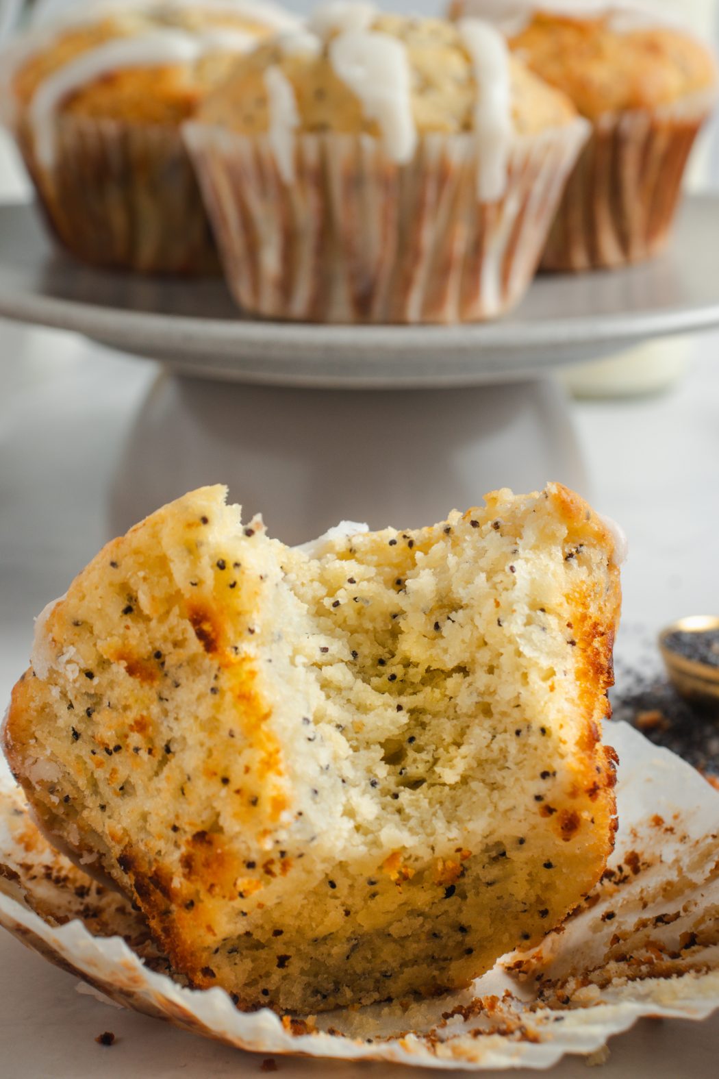 lemon poppy seed muffins with a bite taken out