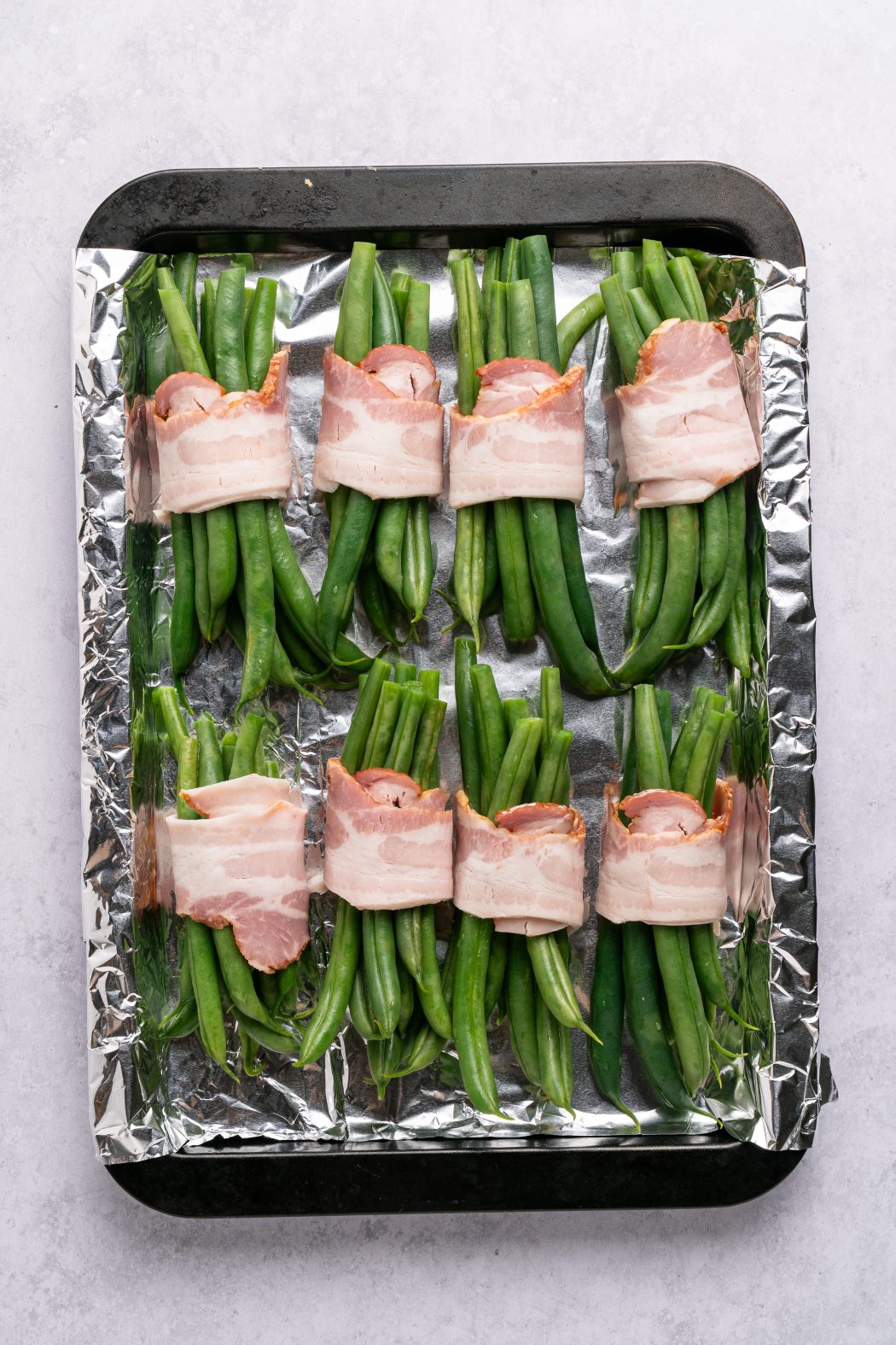 raw bacon wrapped around green beans