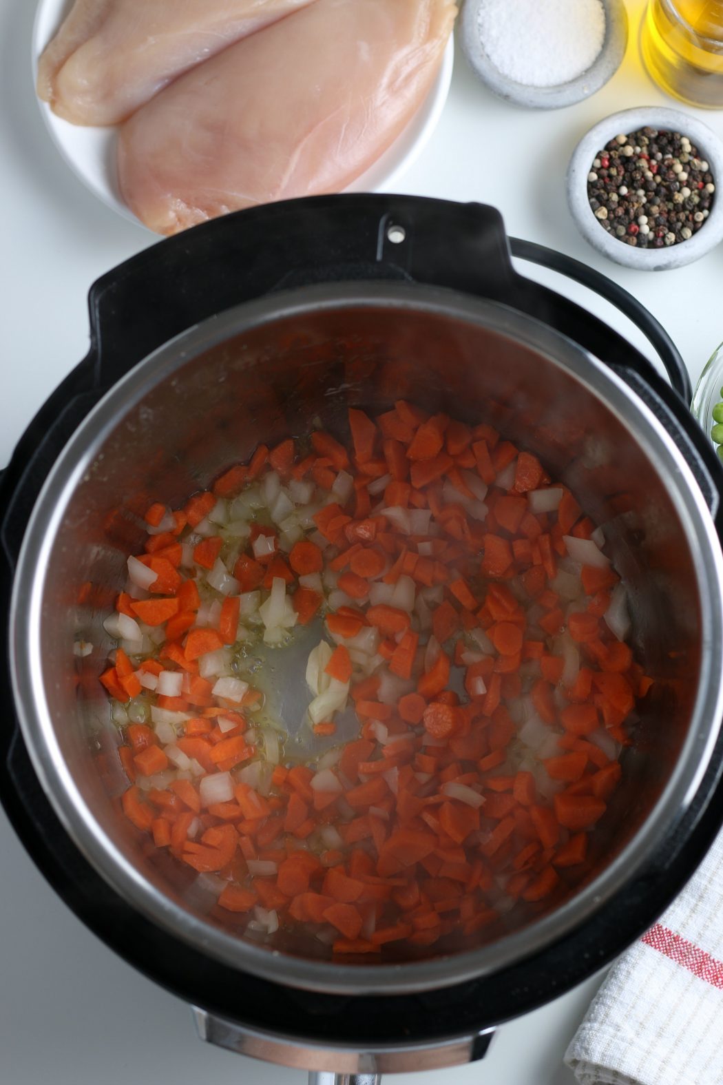 Instant pot with diced onions and carrots