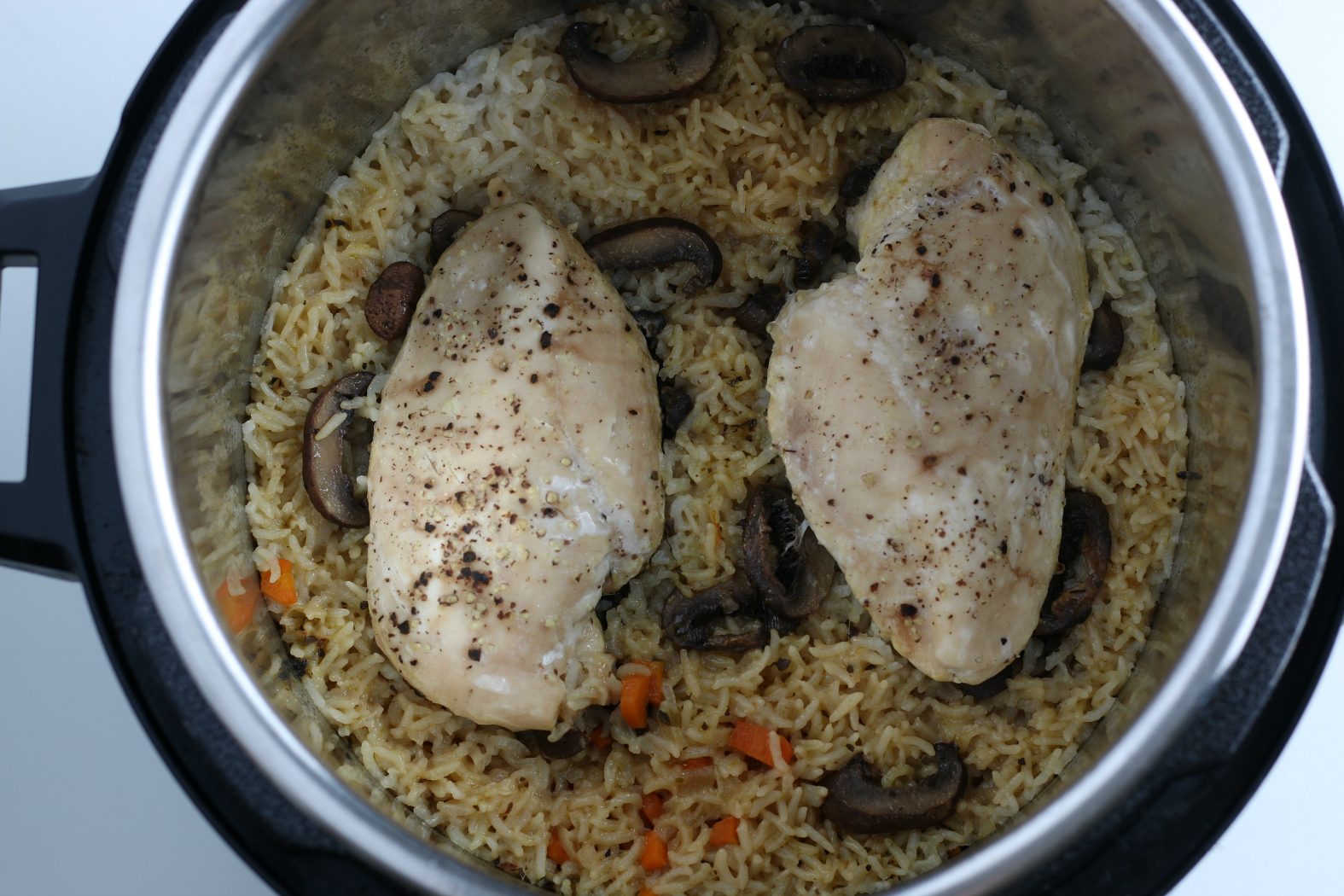 two pieces of chicken cooked in the Instant Pot