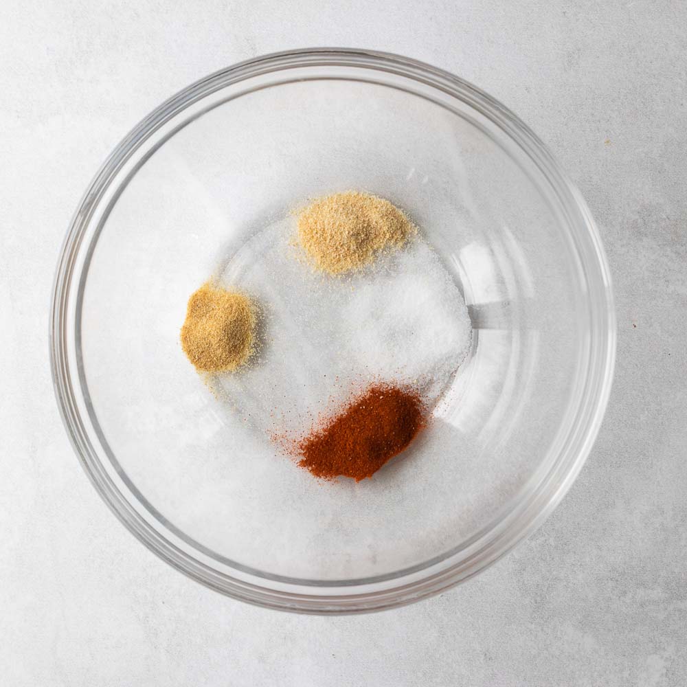 spices in a bowl for chicken legs