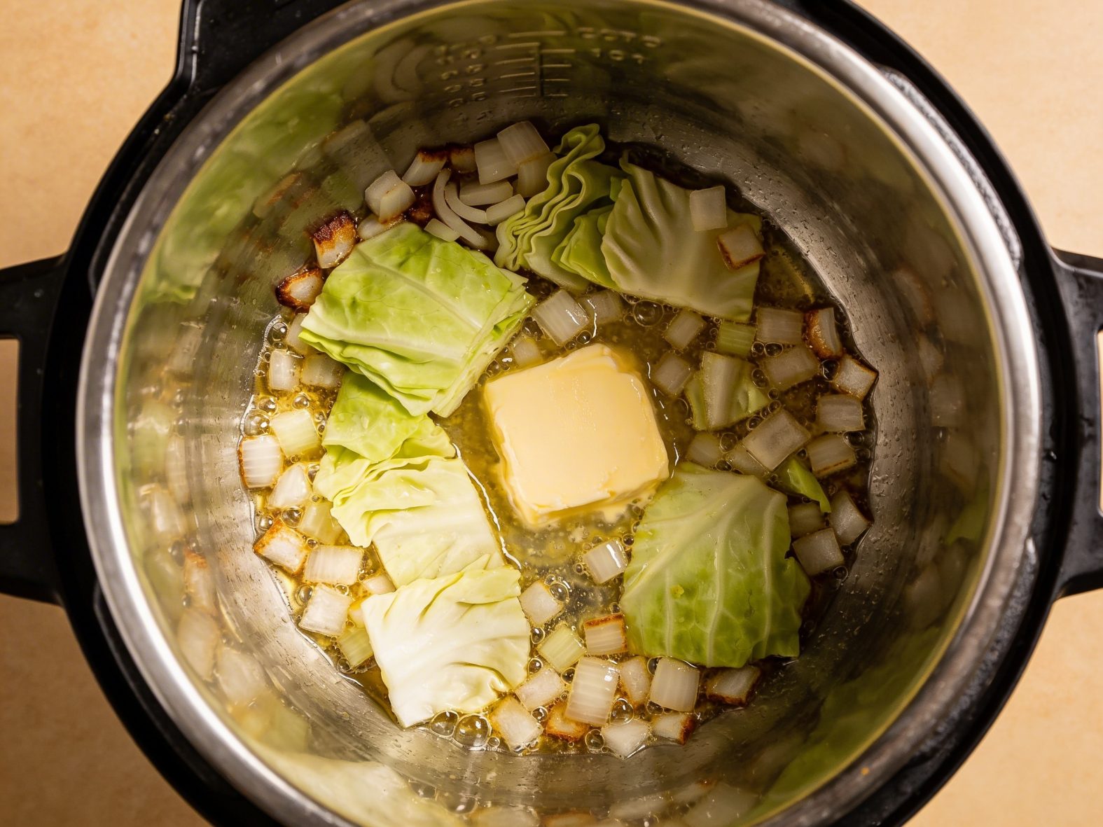 sautéing cabbage and onions with butter in an Instant Pot