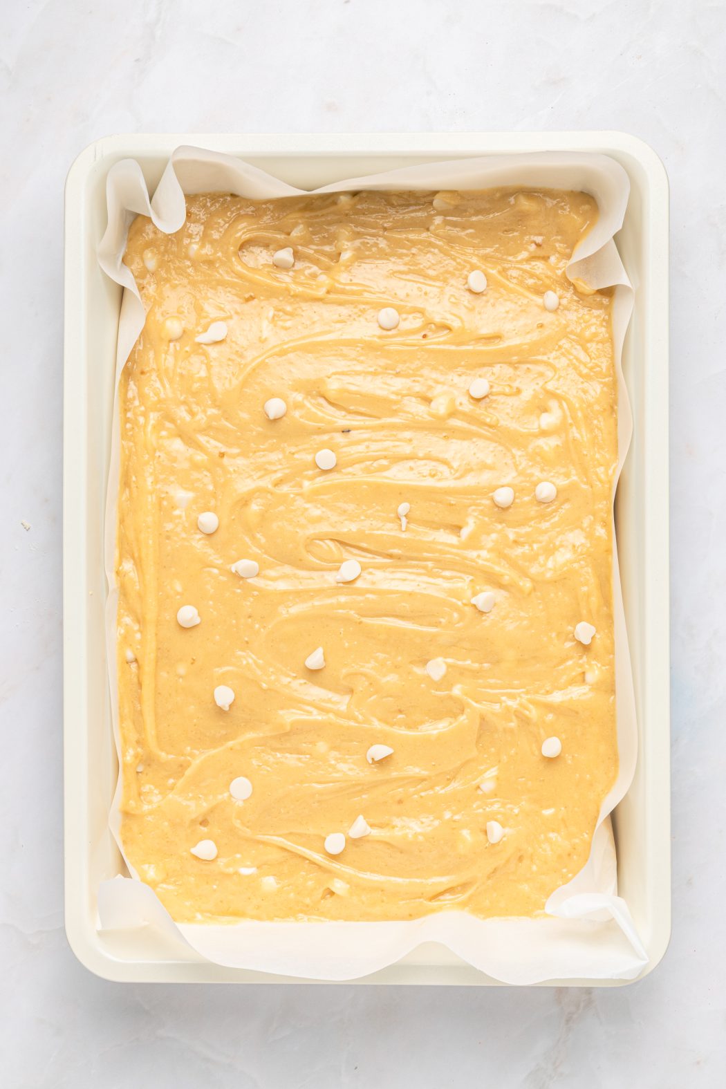 a brownie pan lined with parchment