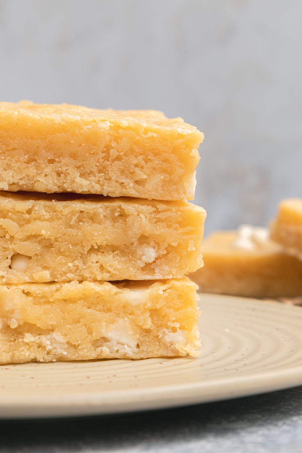 white chocolate brownies stacked on top of eachother